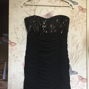 Strapless tight fitting black dress